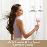Load image into Gallery viewer, Woman using Dreame Hair Gleam pink hair dryer with airflow speed and volume features.