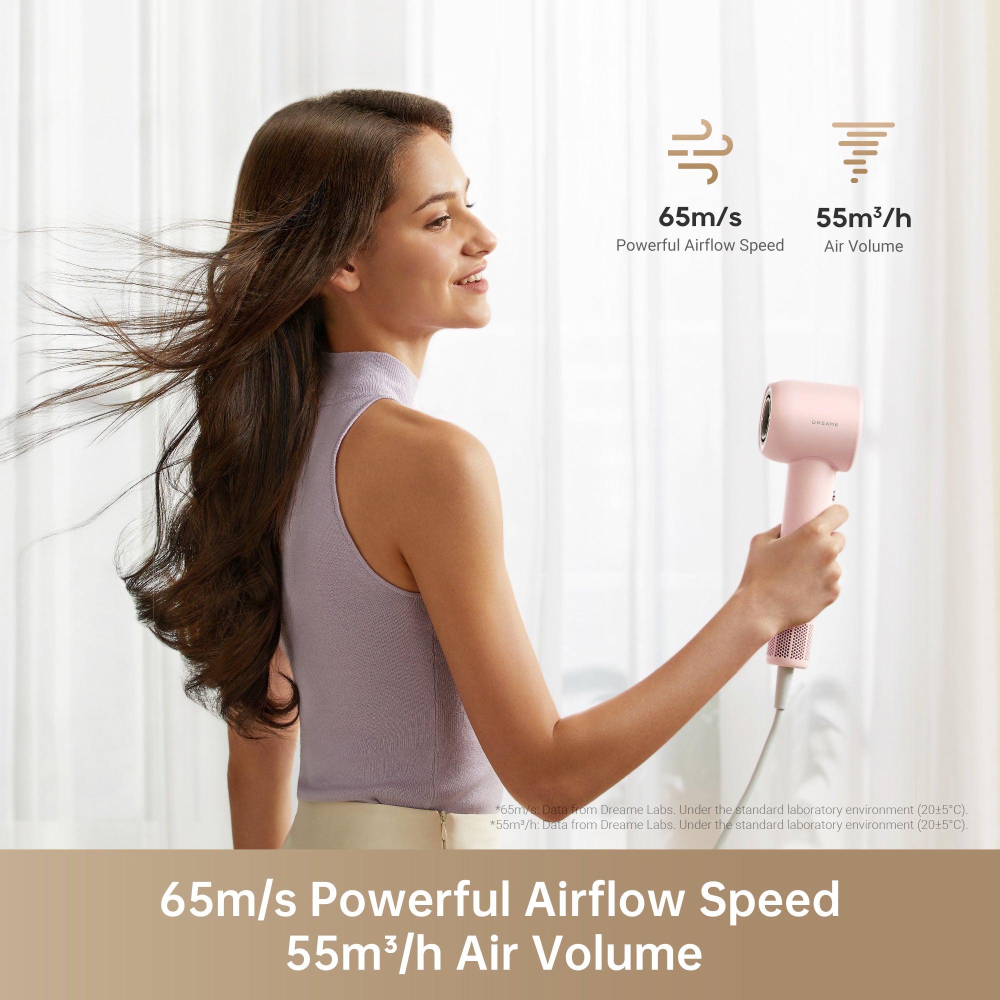 Woman using Dreame Hair Gleam pink hair dryer with airflow speed and volume features.