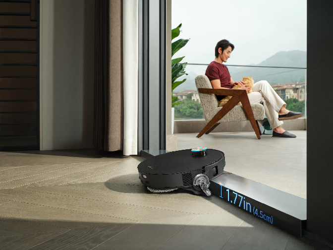 Dreame robot vacuum crossing a threshold on ProLeap legs.