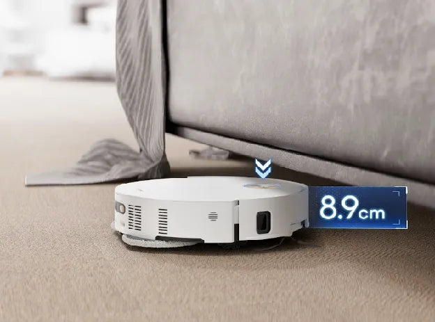 A Dreame white robot vacuum with 3.13in (7.95cm) slim design glides under furniture for deeper cleaning.