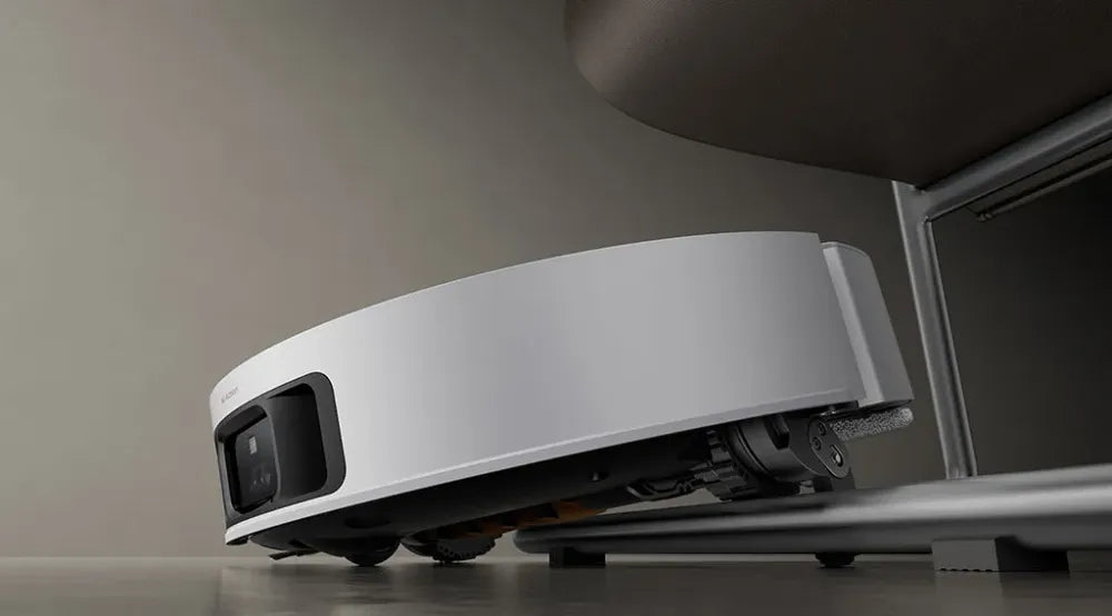 Dreame L60 Pro Ultra using robotic legs to climb over a threshold.