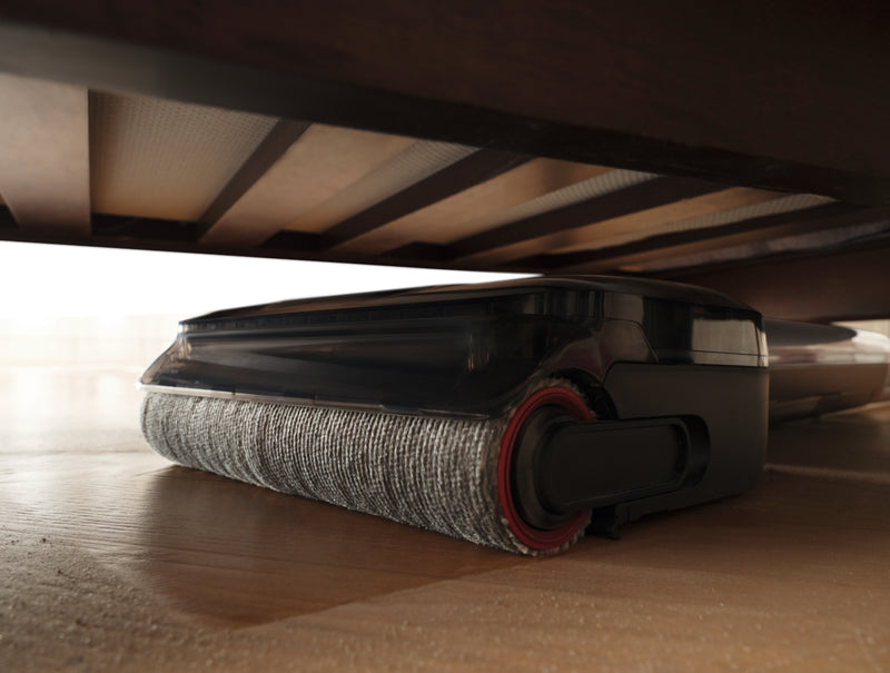 Slim Dreame hard floor cleaner lying flat to clean under low furniture.