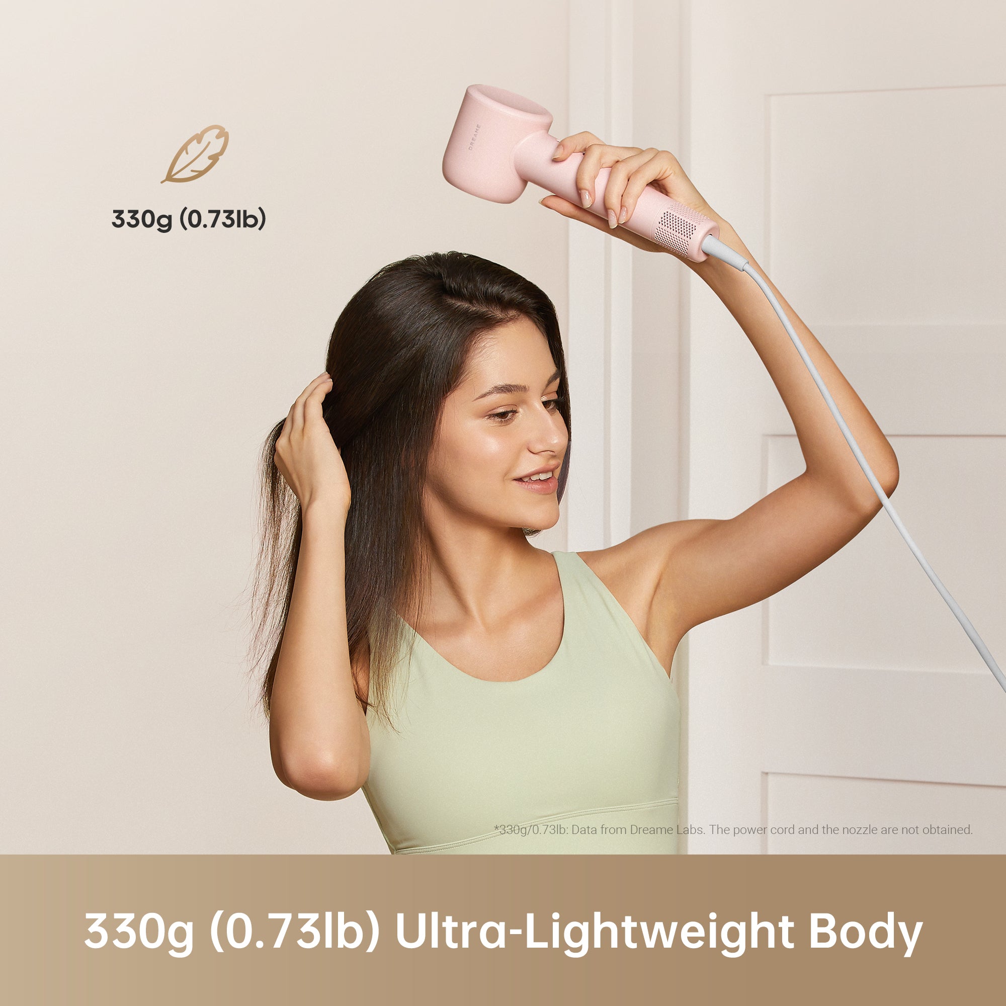 Woman holding lightweight Dreame Hair Gleam hair dryer, weighing 330g.