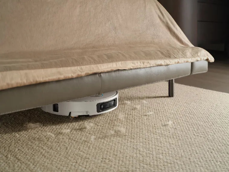 Dreame L60 Pro Ultra robot vacuum with mapping cleaning under low furniture.