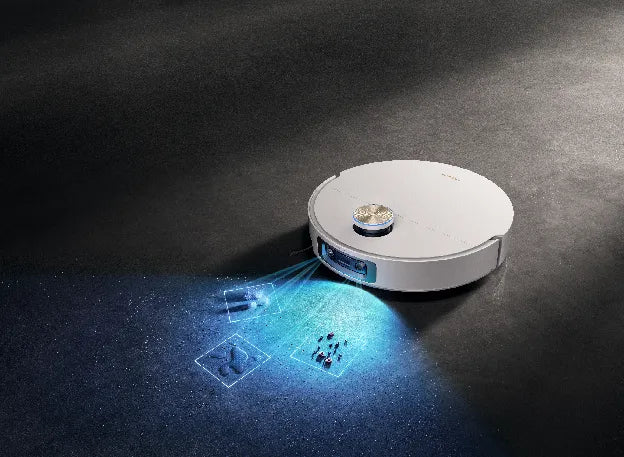 House cleaning robot vacuum using its camera and light to spot types of messes on the floor.