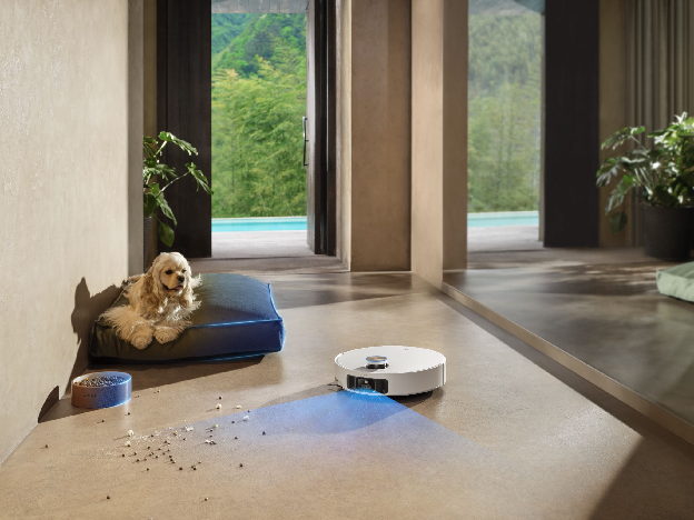 Robot vacuum cleaning around a dog's bed and food bowl in a pet area