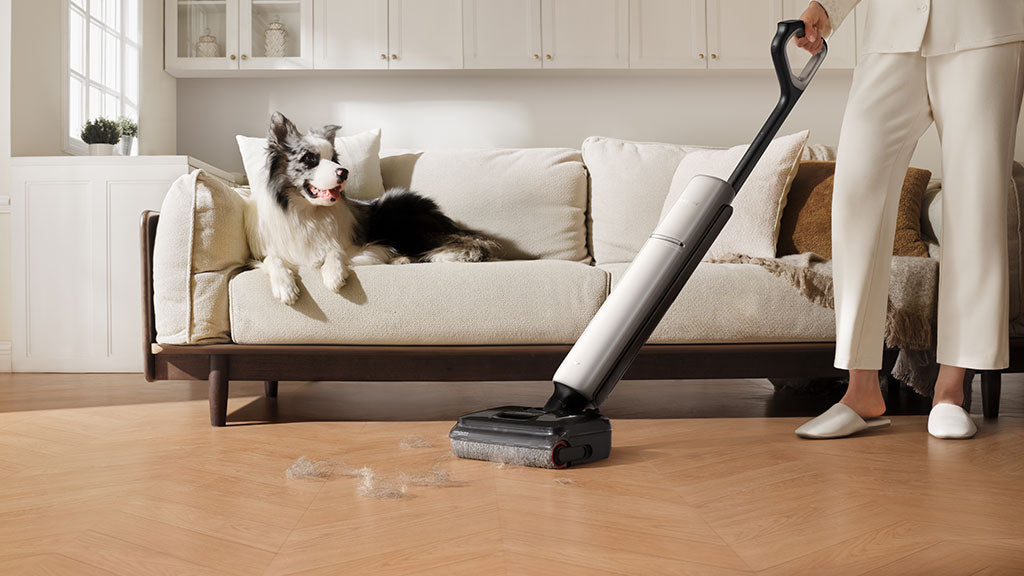 Dreame Aero Pro using TangleCut 2.0 to clean pet hair on hardwood floor.