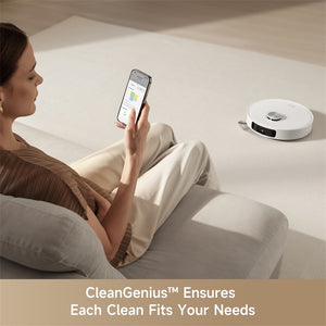 User controlling Dreame L10s Ultra Gen 2 Robot Vacuum via mobile app on couch.