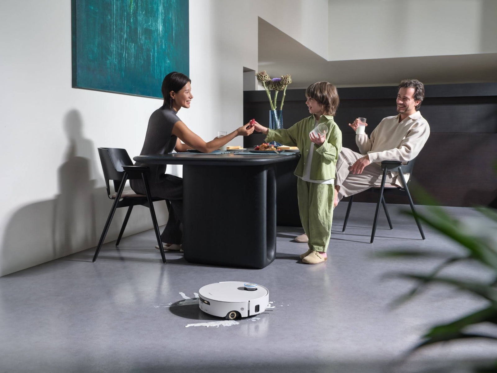 Dreame Aqua10 Ultra Roller mopping a hard floor with fresh water.