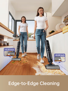 Woman using Dreame H12 Pro for edge-to-edge cleaning in kitchen