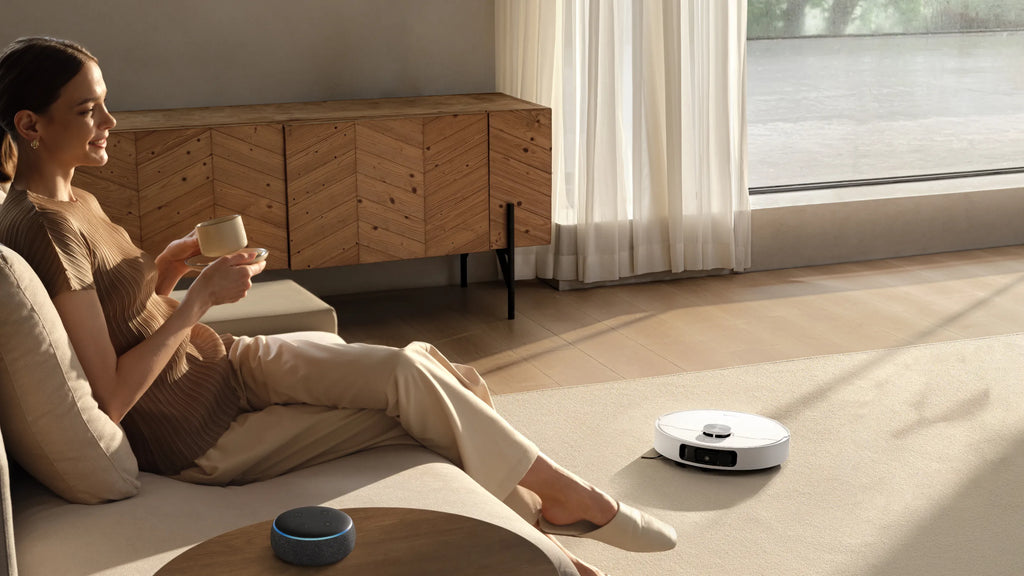 Robot vacuuming carpeted floor while owner rests