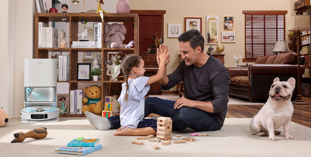 Robot vacuum docked at its base station after cleaning family room with a pet