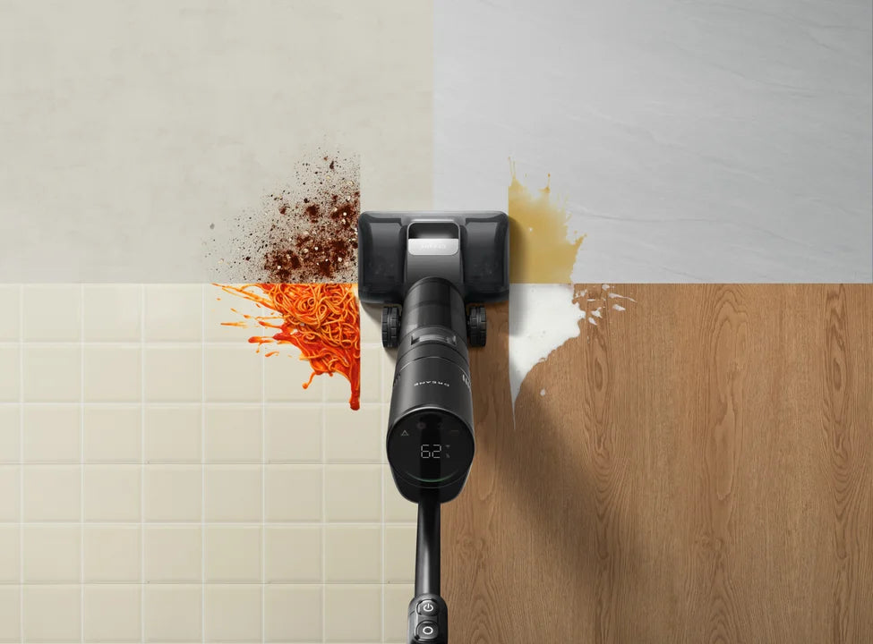 Cordless floor vacuum washing and vacuuming a hardwood floor in one pass.